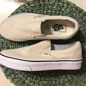 Vans women’s size 8 cream and white slip on shoes.
